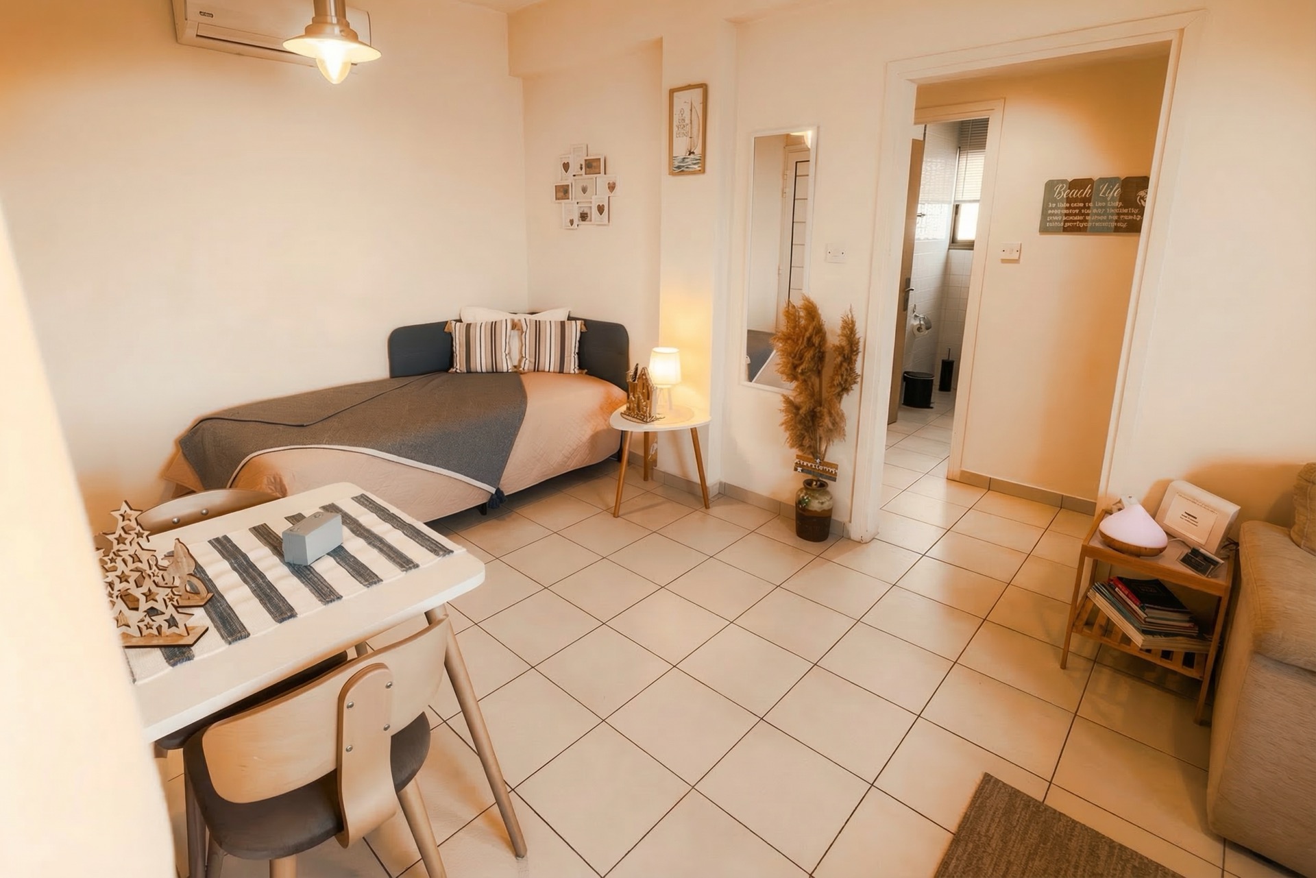 Living area with sofa bed and dining table